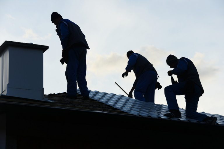 Building roof construction site teamwork